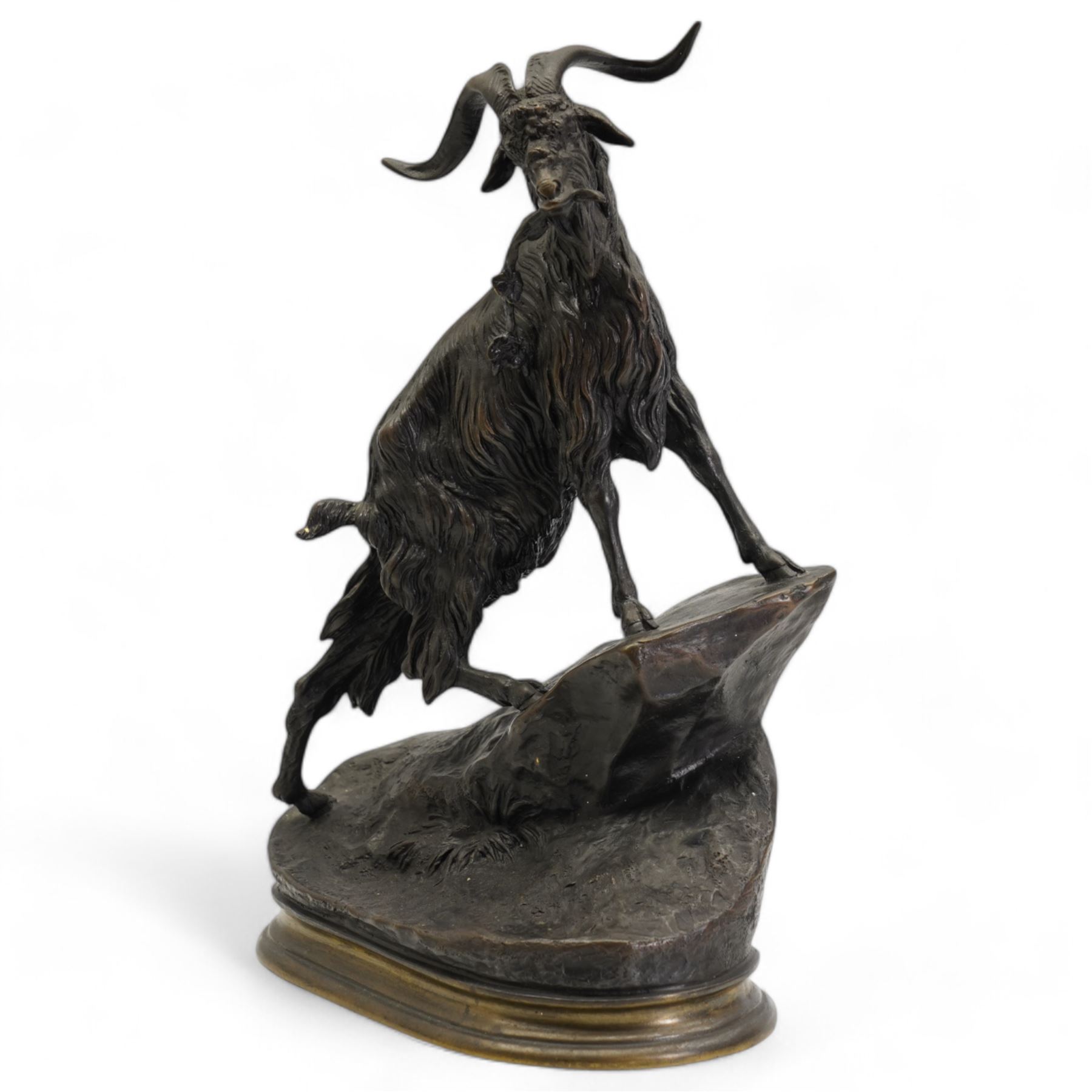 After Jules Moigniez, bronze figure of a goat climbing a rock, on oval plinth, inscribed signature, H28cm