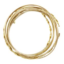 Ten 9ct gold bangles, hallmarked