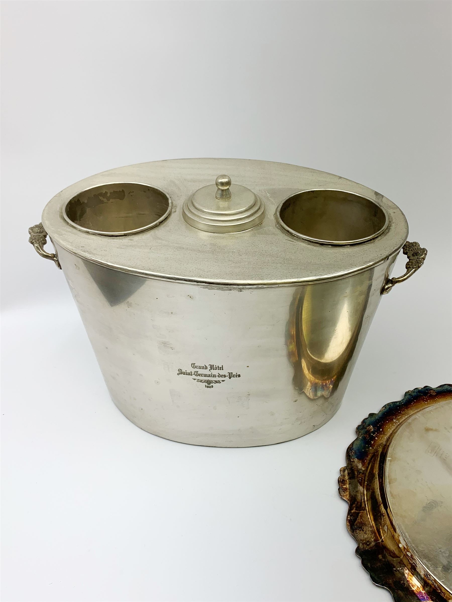 A twin handled twin bottle wine cooler, marked to front and back Grand Hotel Saint Germain-des-Pres 1925, excluding handles L32cm, together with a silver plated salver, D31.5cm. 