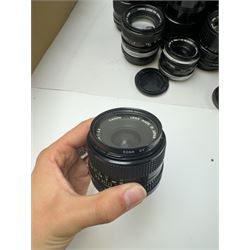 Seventeen Canon camera lenses, mostly FD examples, including 28-85mm 1:4 serial no, 49881, 35-105mm 1:3.5-4.5 serial no. 87632 and 135mm 1:2.8 serial no. 48336, one boxed