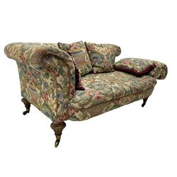 Mid-19th century walnut framed two-seat sofa, rolled arms over sprung seat, single drop-end action, raised on turned and fluted feet with brass cups and castors, upholstered by E & S Gott in traditional floral pattern fabric decorated with urns