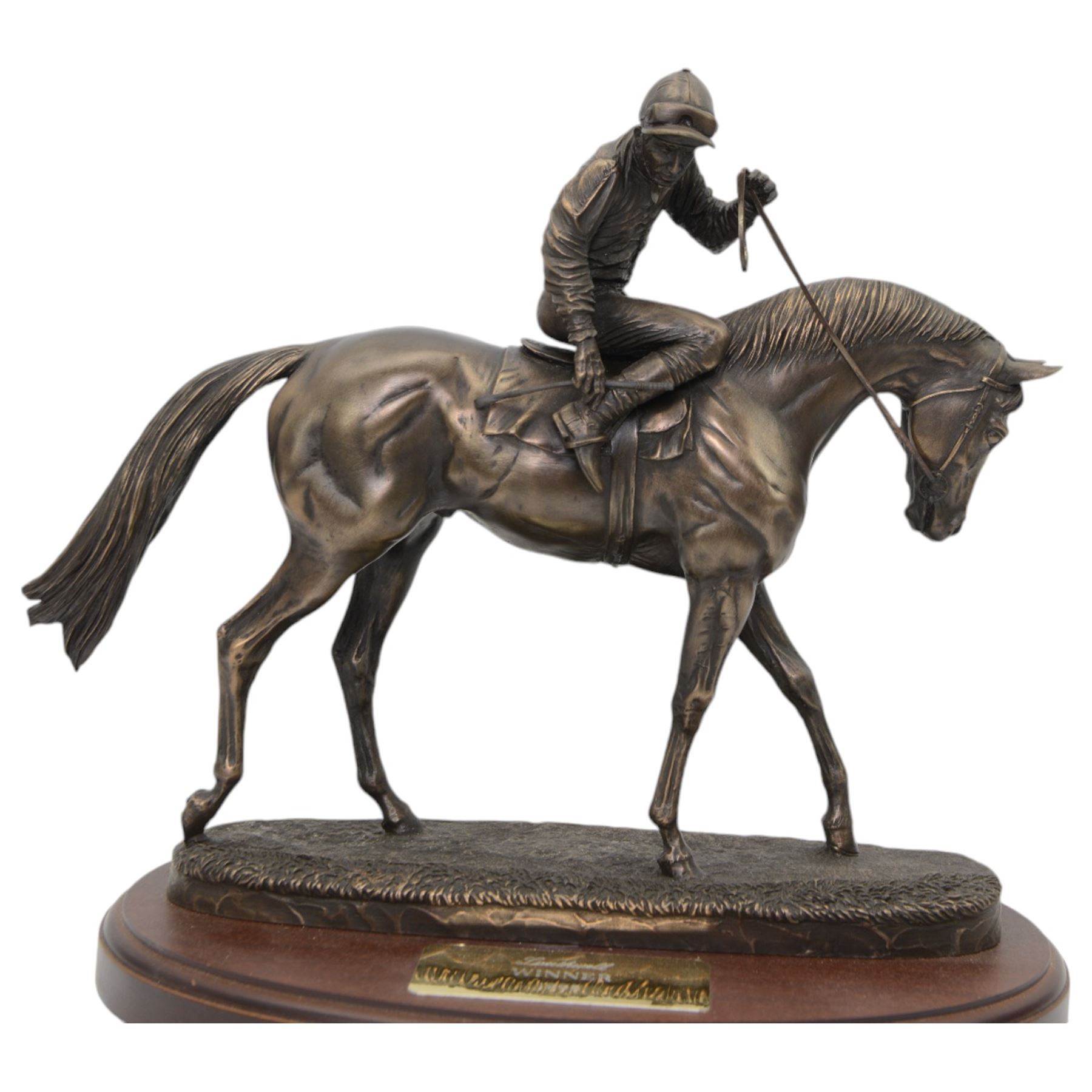 'Southwell, Winner 1995' - bronzed resin trophy by David Geenty of a racehorse with jockey up on oval wooden base, signed 30cm x 32cm 