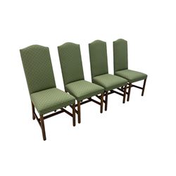 Early 20th century oak extending dining table, rectangular top with rounded corners, on turned baluster supports united by X-stretchers, fitted with a pull-out extending mechanism (106 x 142 - 228cm, H76cm); set of eight high-back dining chairs upholstered in green fabric with geometric diamond pattern