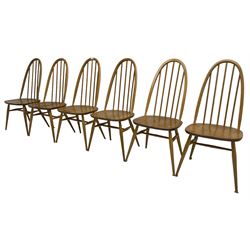 Ercol - light elm and beech set of ten (8+2) 'Quaker Windsor' dining chairs, high hoop and stick back over splayed supports united by H-stretcher, with foliate patterned crimson loose seat cushions