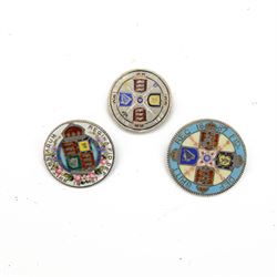 Three Queen Victoria enamelled silver coins, comprising 1887 florin, 1887 halfcrown with flower decoration and 1887 double florin, all with brooch mounts but missing pins