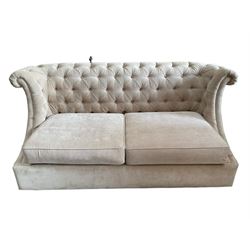 Grande wing back sofa bed, upholstered in beige buttoned fabric, metal action pull out double bed