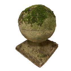 Set of three weathered cast stone gate post finials, circular orb on step-canted square base 