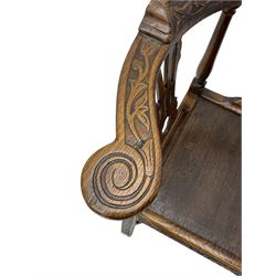 Elm 'Windsor' splat back corner armchair, shaped cresting rail carved with leaves over shaped and pierced splat, the curved arms carved with foliage and scrolled terminals, turned upper supports and a further two splats, panelled seat within foliate carved seat rails, on square rear supports with front shell carved cabriole support, united by plain x-frame stretchers