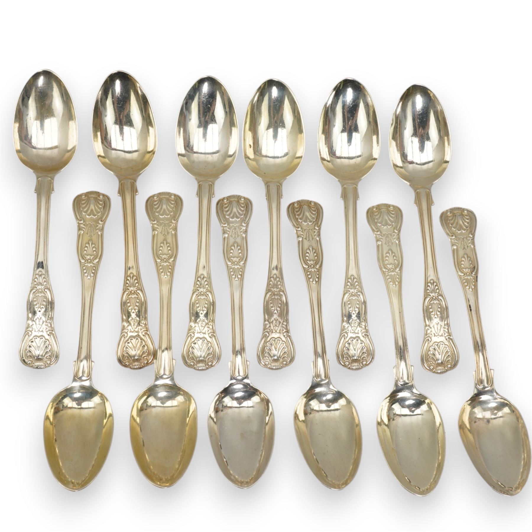 A matched set of 19th century silver Kings pattern cutlery comprising six table spoons, ten table forks, twelve dessert spoons, fish slice, pair of sauce ladles, ten teaspoons, six fish knives, seven silver handled knives, two salt spoons  and fifteen dessert forks, various dates and makers 