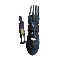 Carved tribal mask and a carved wooden figure