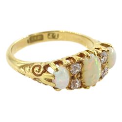 Early 20th century 18ct gold three stone opal and four stone old cut diamond ring, hallmarked