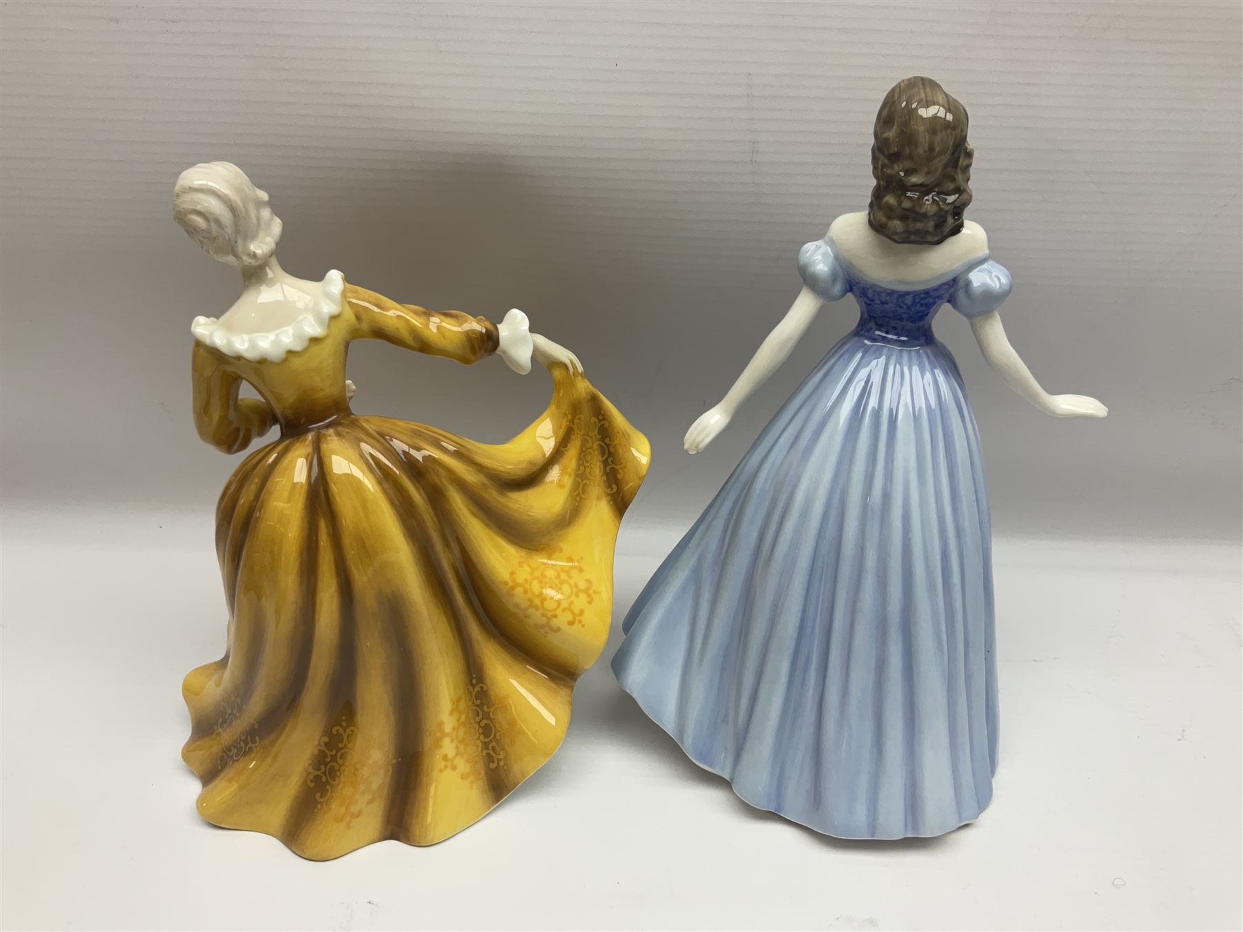 Three Royal Doulton figures, comprising Anna HN4391, Kirsty HN2381 and Deborah HN4468, together with a similar Coalport figure and ten smaller Coalport figures (14)