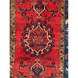 Persian Hamadan crimson ground rug (155cm x 105cm); Persian crimson ground rug (265cm x 130cm); small Bokhara red ground rug (118cm x 75cm)