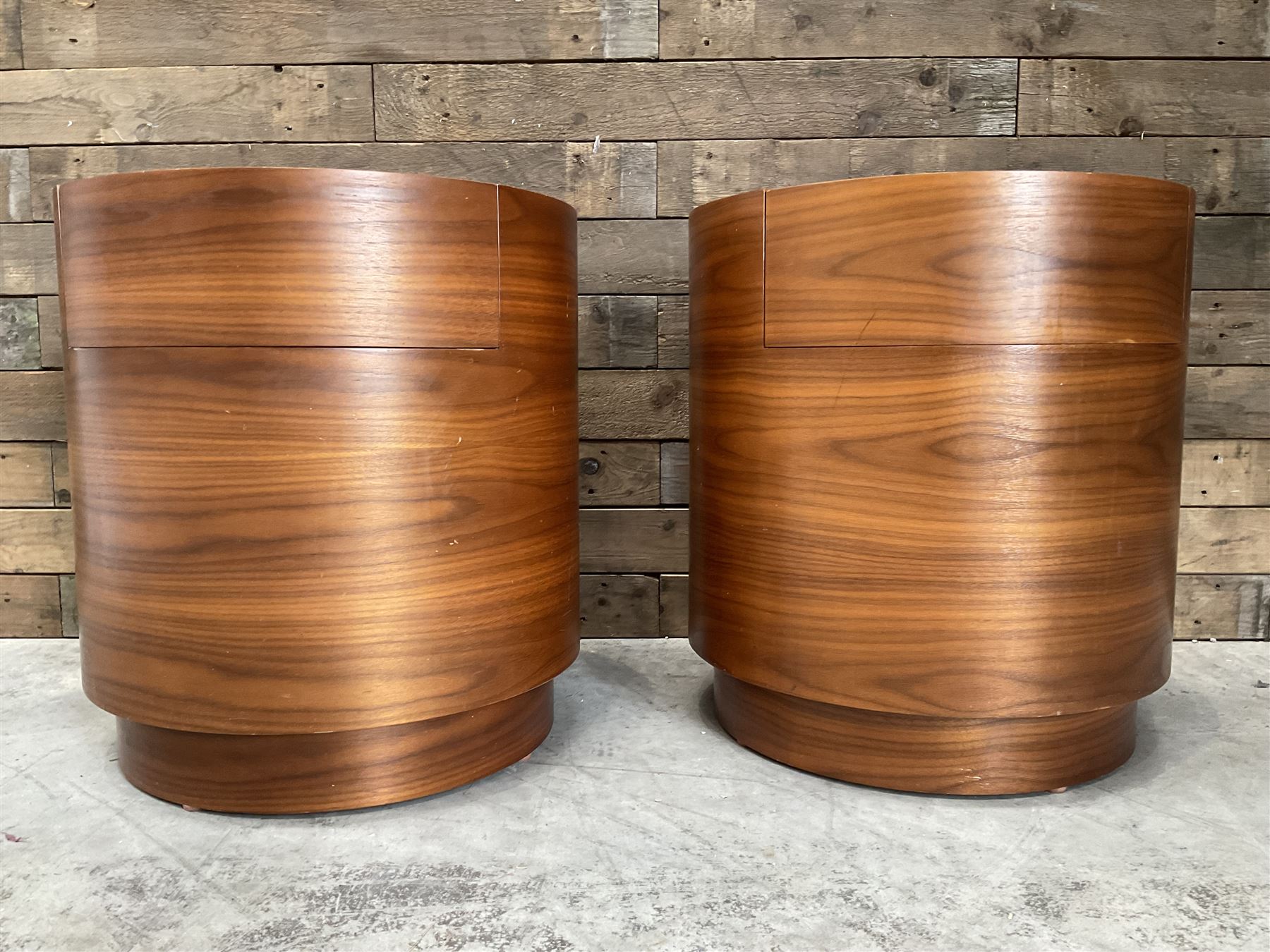 Pair of walnut circular barrel shaped lamp tables, fitted with single drawer