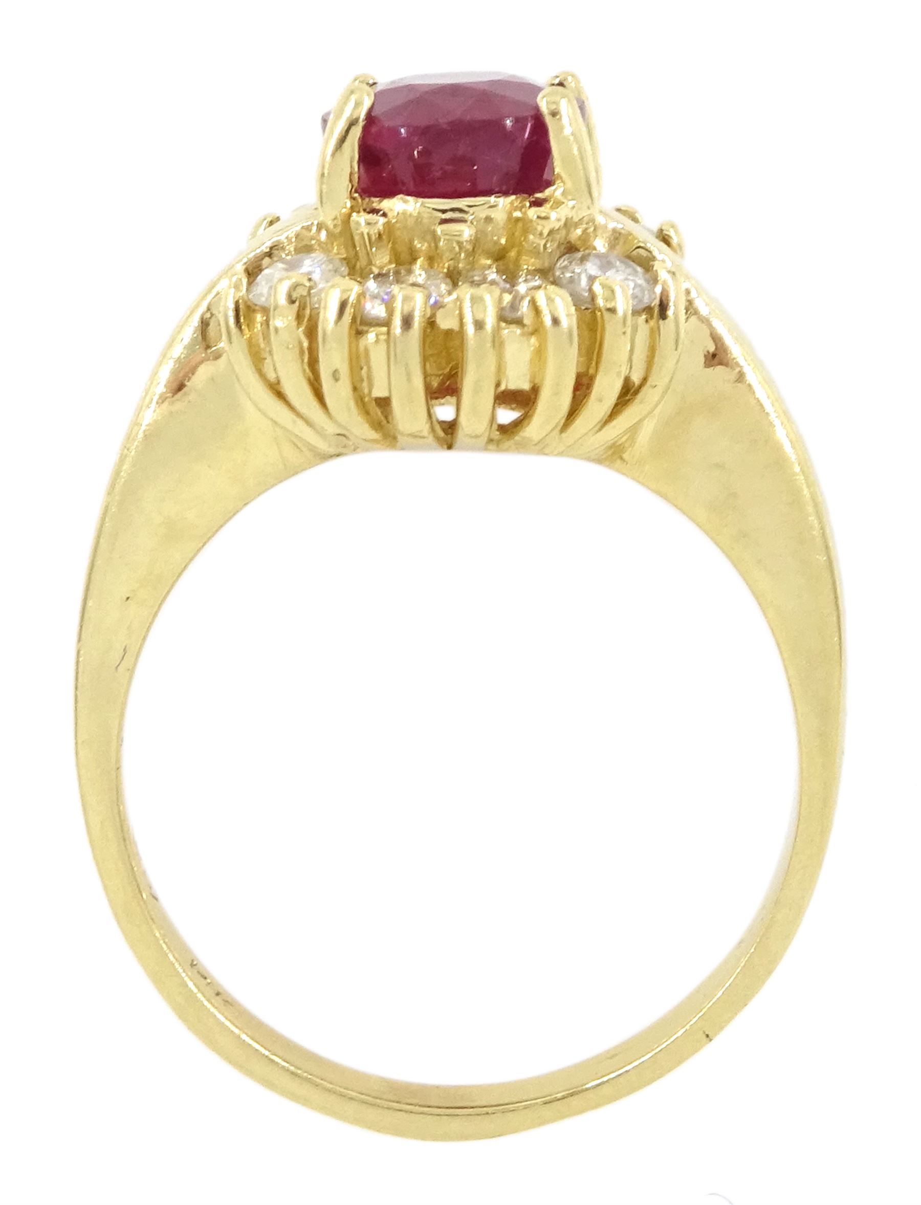 14ct gold oval cut ruby and round brilliant cut diamond cluster ring, stamped, ruby approx 2.00 carat, total diamond weight approx 0.40 carat