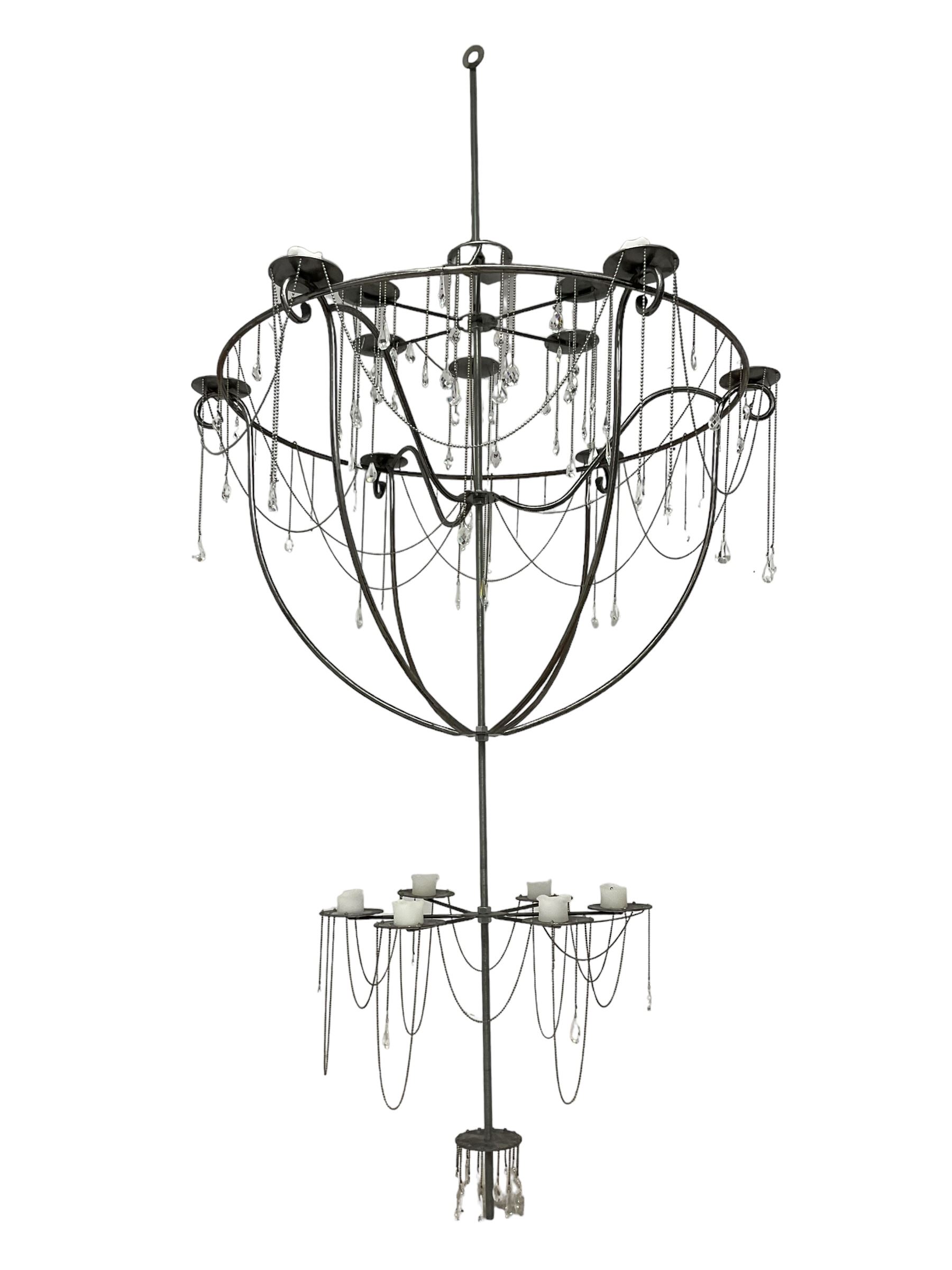 Large bespoke wrought iron cage candle chandelier, the top tier with six extending branches over bell-shape cage with scrolled supports and six branches, six branch lower tier; together with ceiling winch 