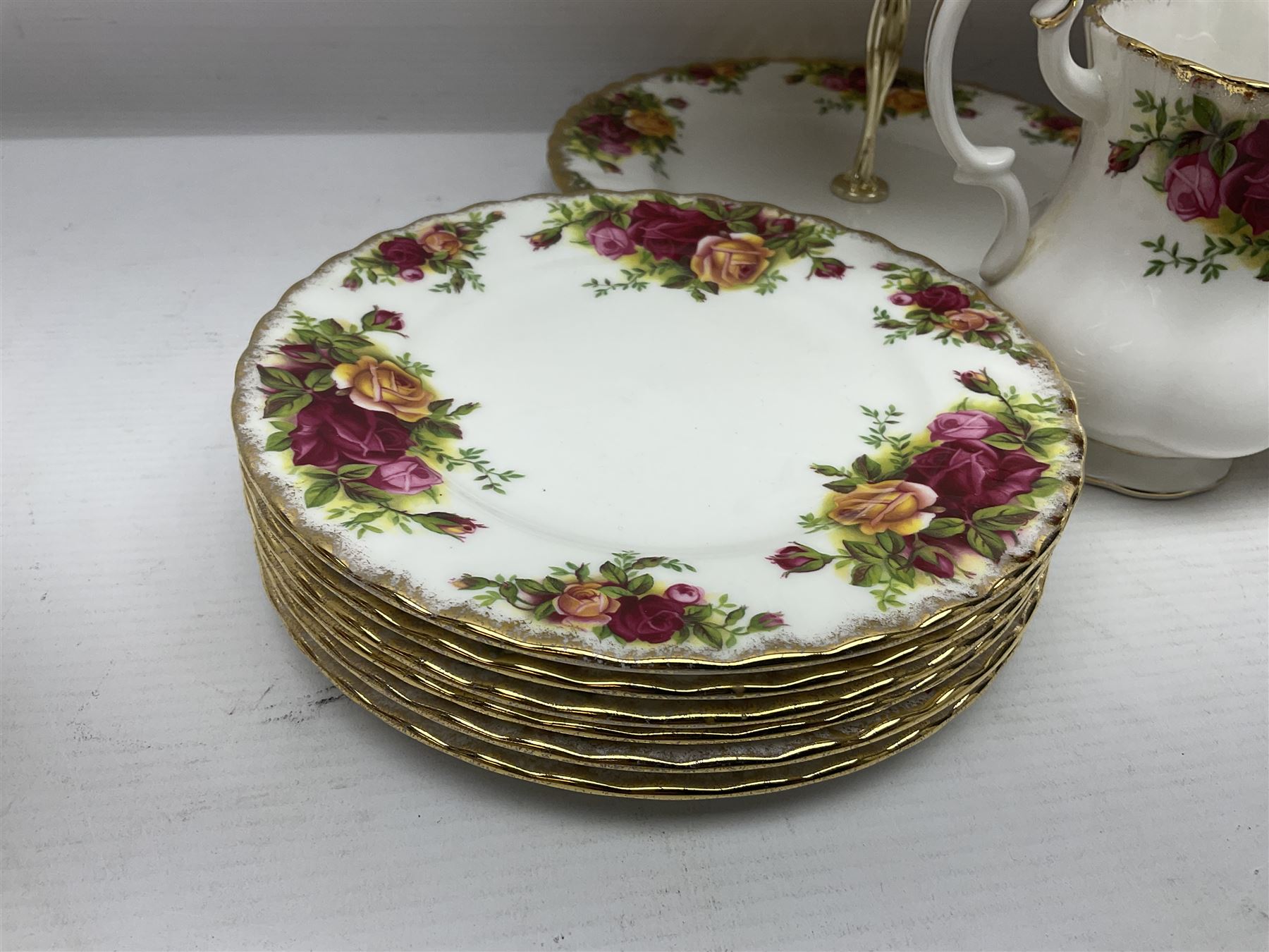 Royal Albert Old Country Roses pattern tea service for six, comprising teapot, sucrier, milk jug, dessert plates, one cake plate, one two tiered cake stand, salt and pepper pots and bud vase 