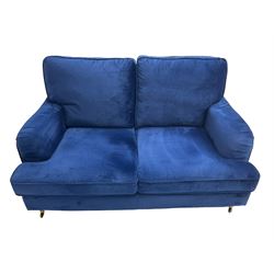 Howard design - two-seat sofa upholstered in blue fabric, traditional shape with rolled arms, on walnut finish turned feet with brushed metal cups and castors