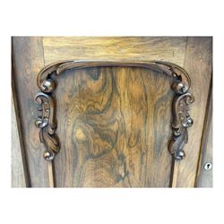 Mid-19th century rosewood chiffonier, raised back with scroll and leaf carved shaped pediment, serpentine top over drawer and double cupboard with scrollwork decoration, on shaped plinth base