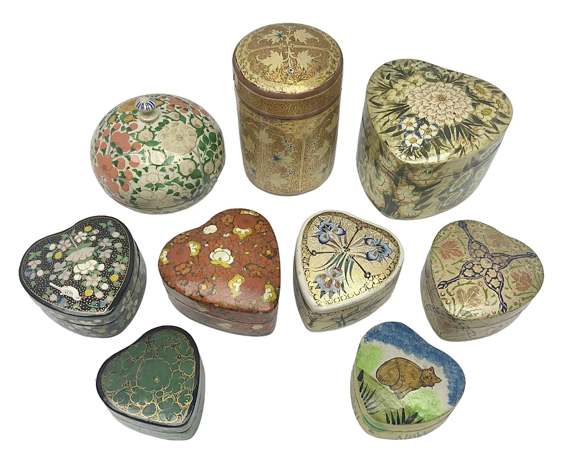 Nine lacquered boxes, including seven heart shaped examples, mainly decorated with floral designs, largest H12cm