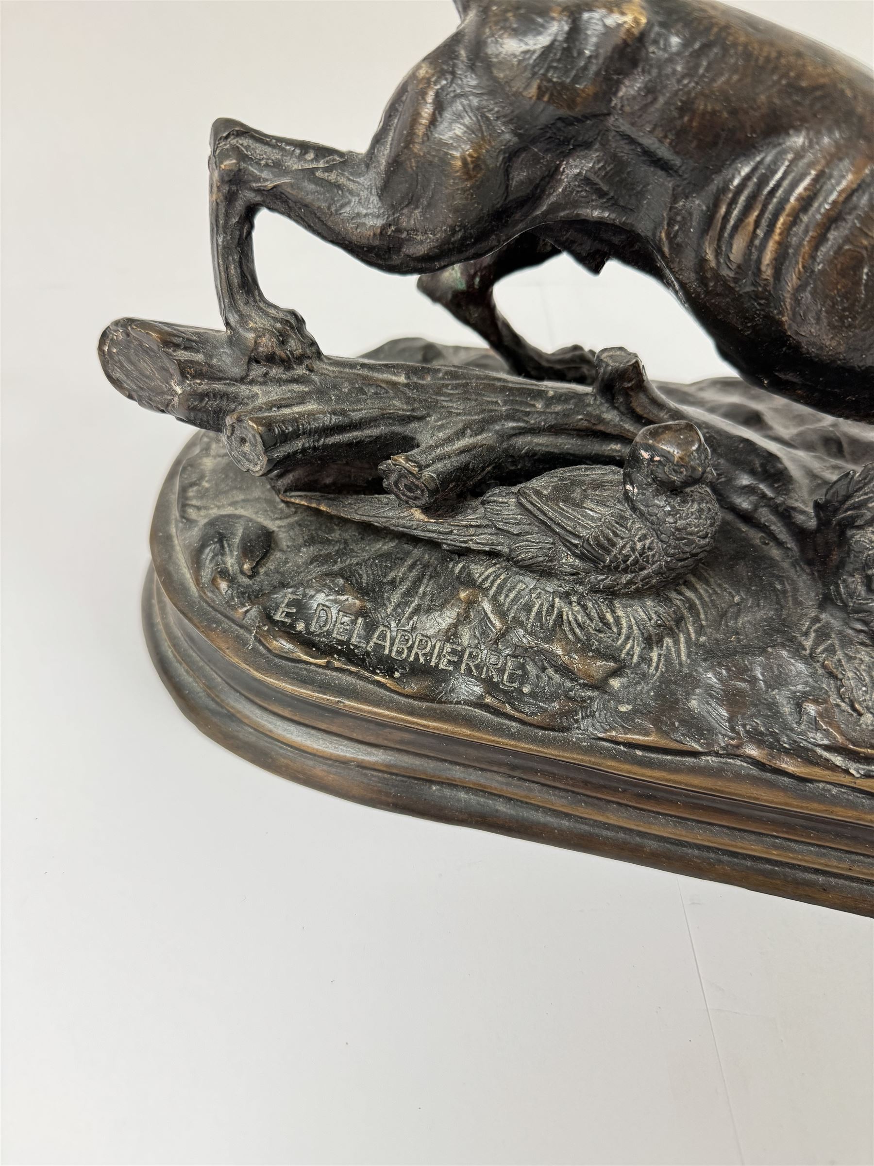 Bronzed figure after Paul-Edouard Delabrierre, modelled as a crouching Pointer with pheasant, inscribed E. Delabrierre to base, H16.5m