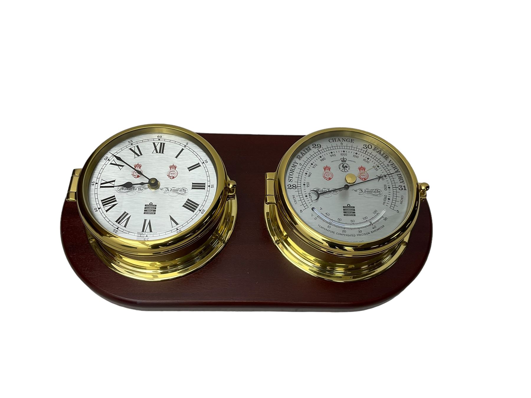 Sewell's - 20th century matching compendium aneroid barometer and quartz clock on a mahogany board,