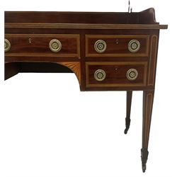 Edwardian inlaid mahogany kneehole dressing table, raised shaped oval bevelled mirror back, fitted with five drawers with banding and stringing, on square tapering supports with castors