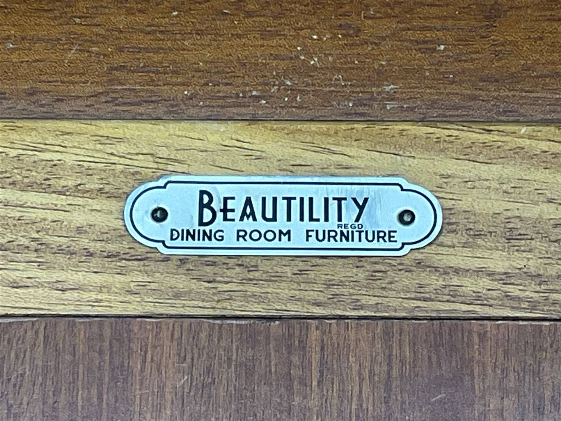 Beautility - mid-20th century walnut sideboard, fall-front with sliding top enclosing mirror interior, fitted with two drawers and flanking cupboards, on sledge feet with curved stretchers 