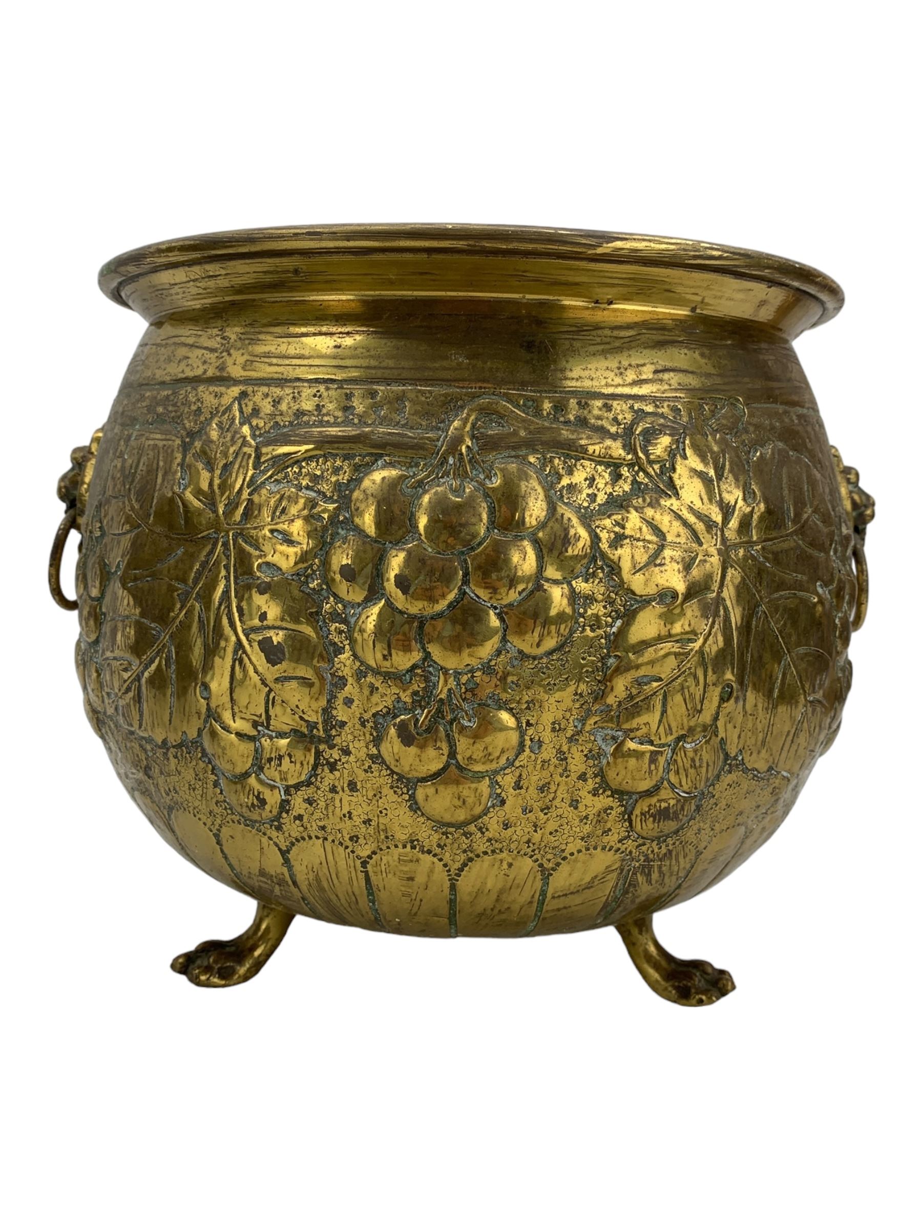 19th century copper coal scuttle, brass twin-handled planter, the bulbous body embossed with fruiting vines, H23cm (2)