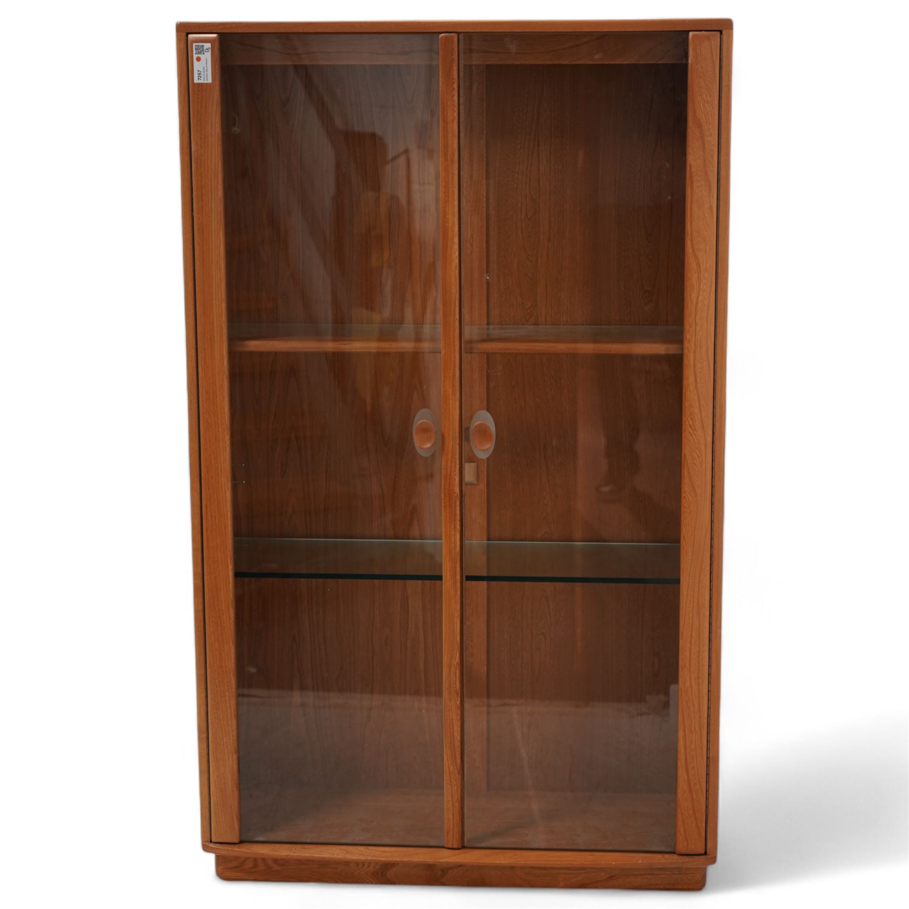 Ercol - elm display cabinet, adjustable shelves enclosed by two glazed doors 