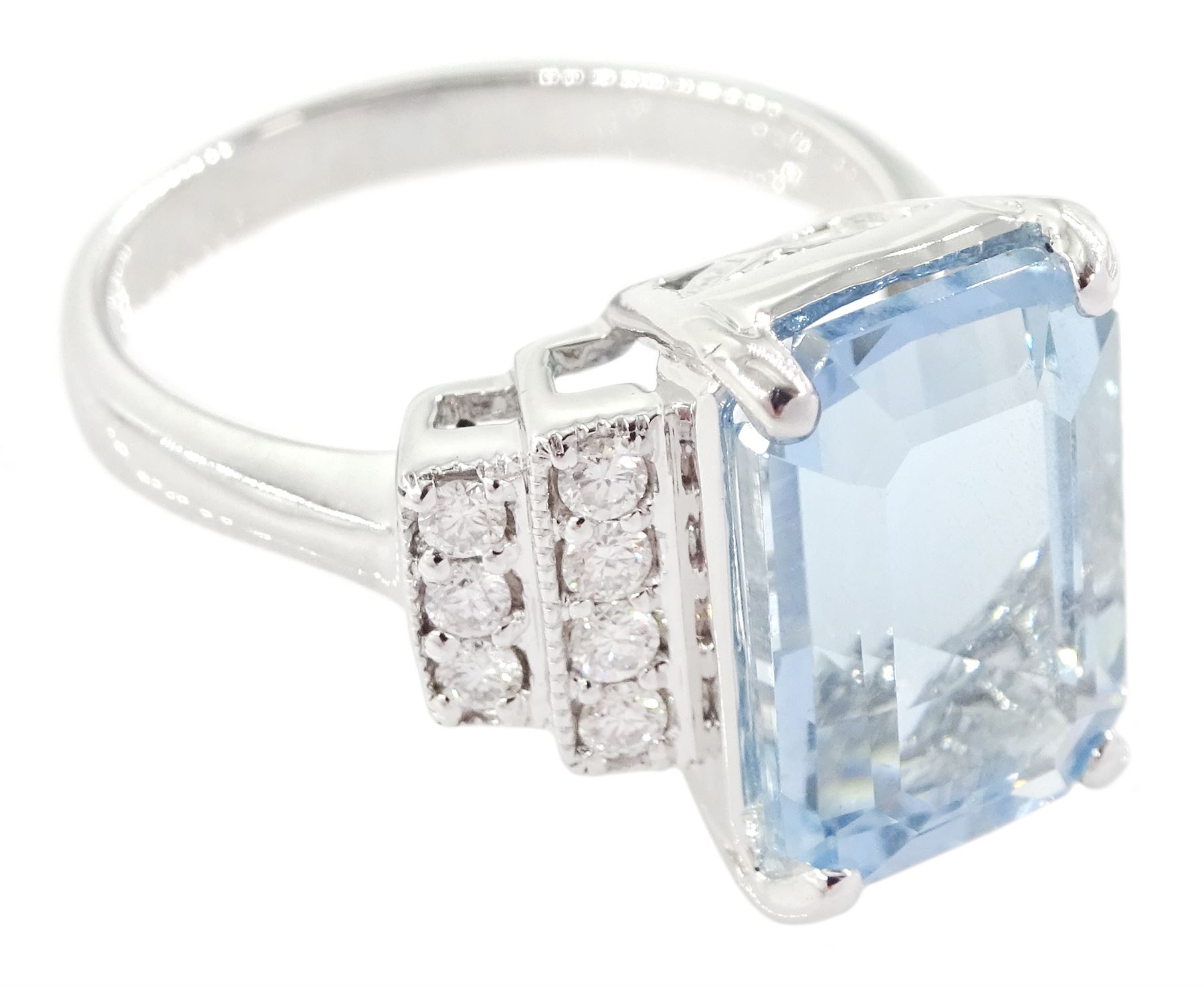 18ct white gold emerald cut aquamarine ring, with stepped design round brilliant cut diamond shoulders, stamped 750, aquamarine approx 4.90 carat, total diamond weight approx 0.30 carat