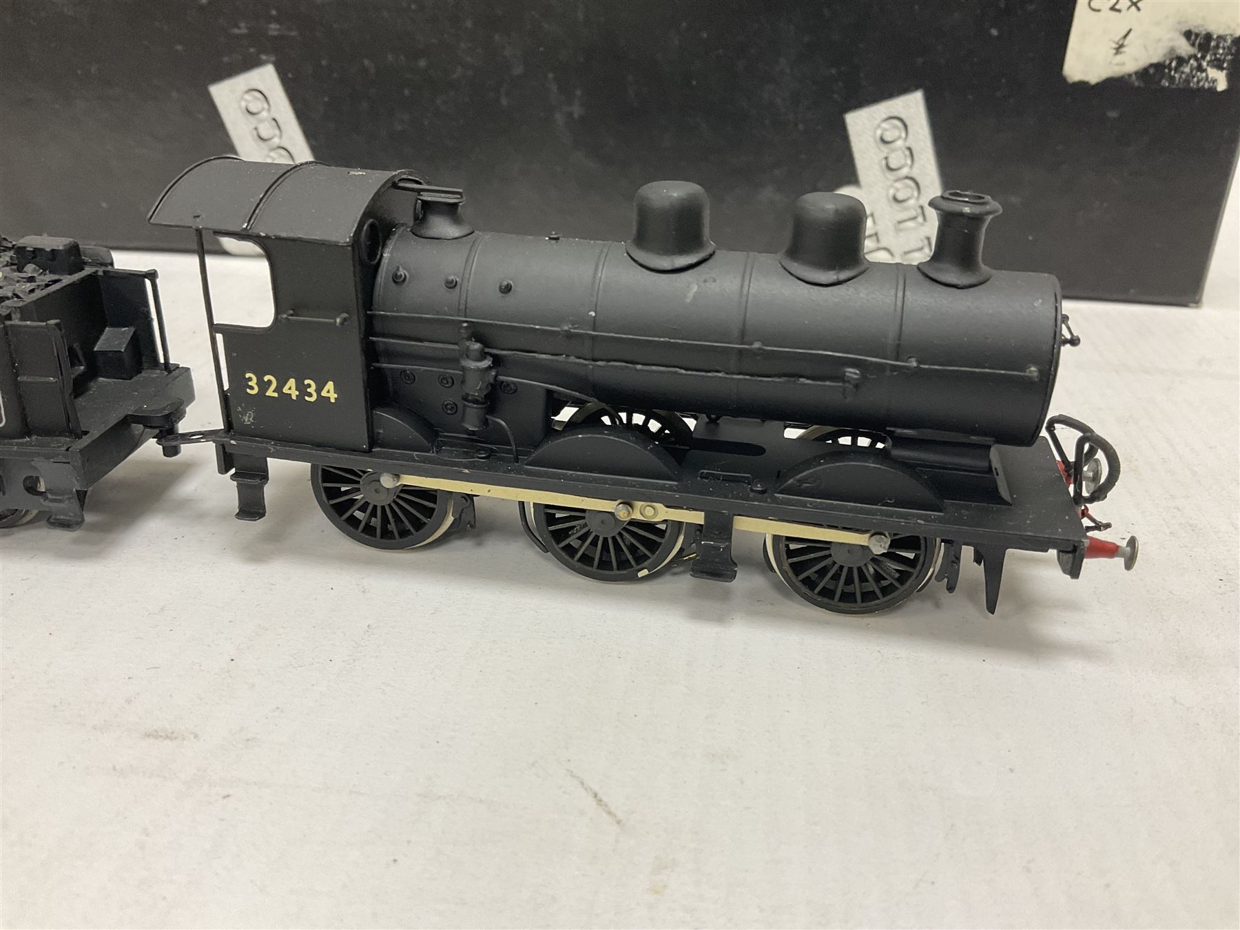 ‘00’ gauge - two kit built steam locomotive and tenders comprising Class 0395 Jumbos 0-6-0 no.30566 finished in BR black; Class C2X Large Vulcans 0-6-0 no.32434 finished in BR black; both with DJH Models boxes (2) 