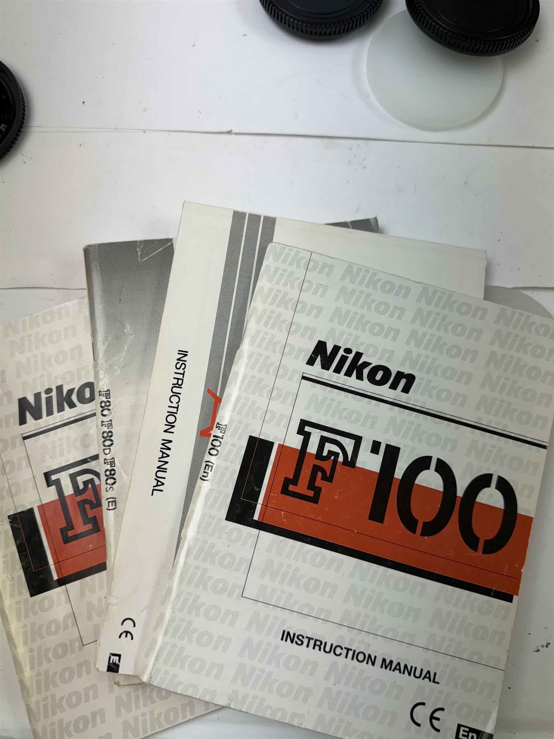 Collection of Nikon cameras, to include F60 serial no. 2574507, boxed, F70 serial no. 2807667, F75 serial no. 2062602, with an AF Nikkor 28-100mm 1:3.5-5.6 G lens serial no. 2166614, two F80 examples serial nos. 2553343 & 2777869, two F90X examples serial nos. 2209737 & 2438888, one boxed and an F100 serial no. 2051550