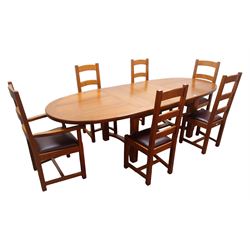 French solid oak oval extending dining table with two leaves, square supports joined by curved 'H' stretcher; set of six (4+2) ladder back chairs with upholstered seats (W59cm)