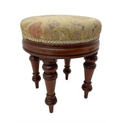 Pair of Victorian walnut circular stools, cushioned seats upholstered in floral pattern fabric, moulded seat rail over turned supports 