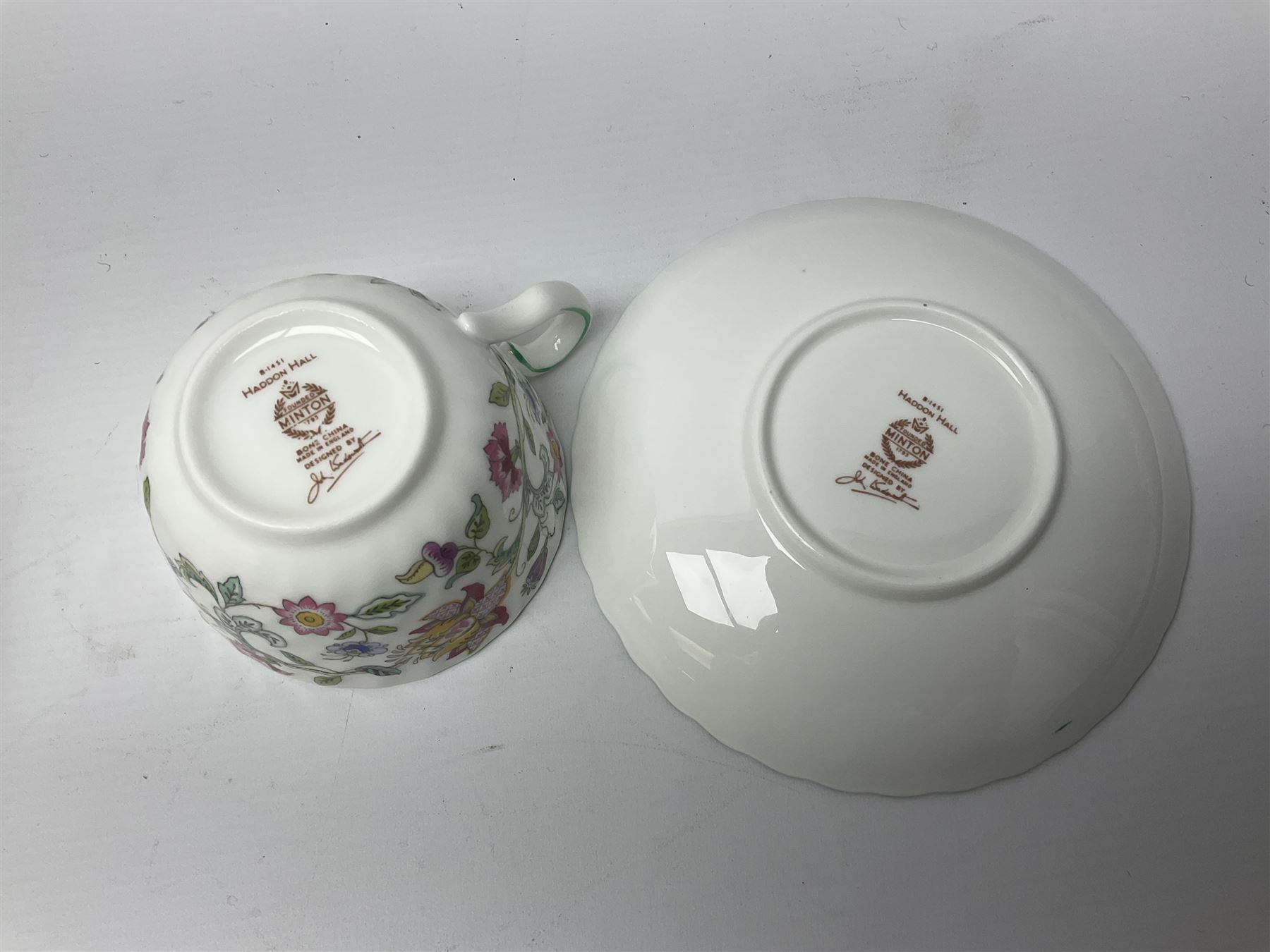 Minton Haddon Hall pattern tea service for twelve place settings, to include teapot, sugar bowl, milk jug, twelve cups and saucers and twelve dessert plates (39)