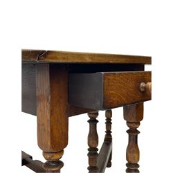 18th century oak dining table, oval drop-leaf top on gate-leg action base, turned supports united by turned stretchers, fitted with single end drawer