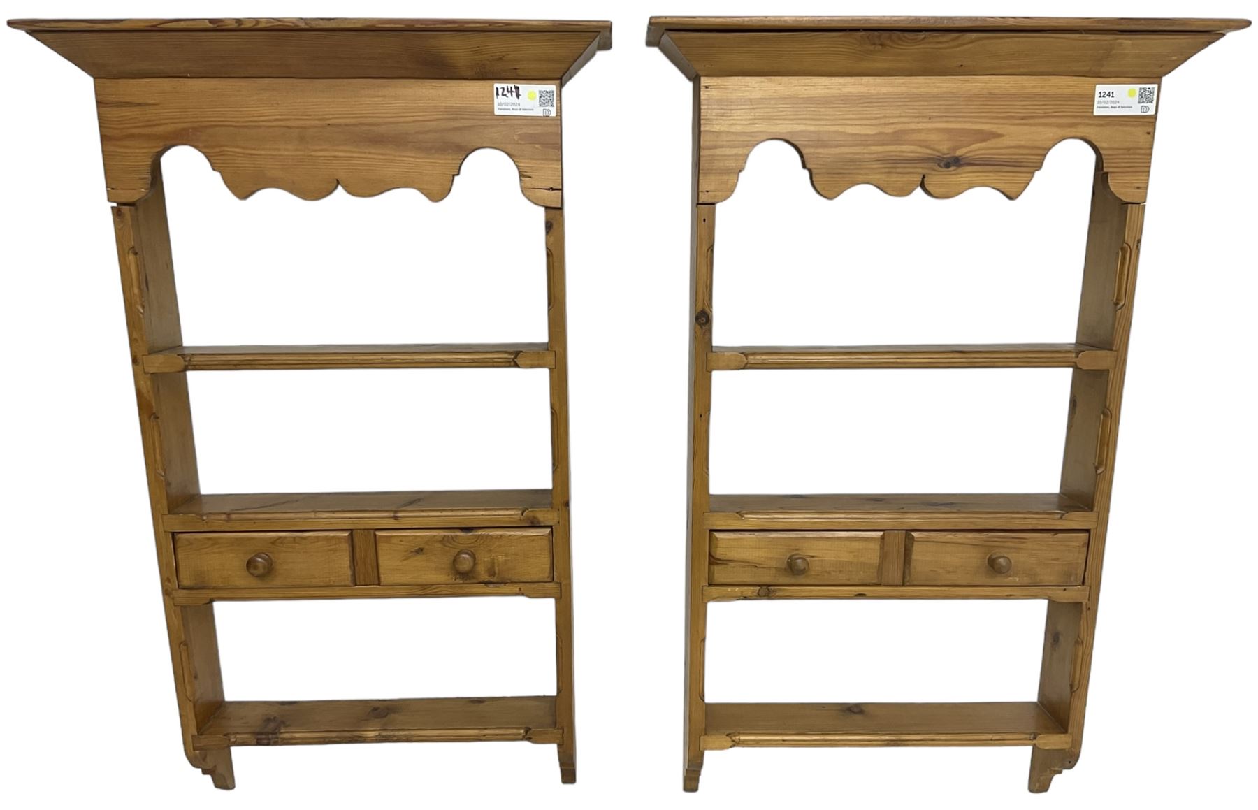 Pair of 20th century small waxed pine plate racks, shaped apron over three shelves and single drawer styled as two