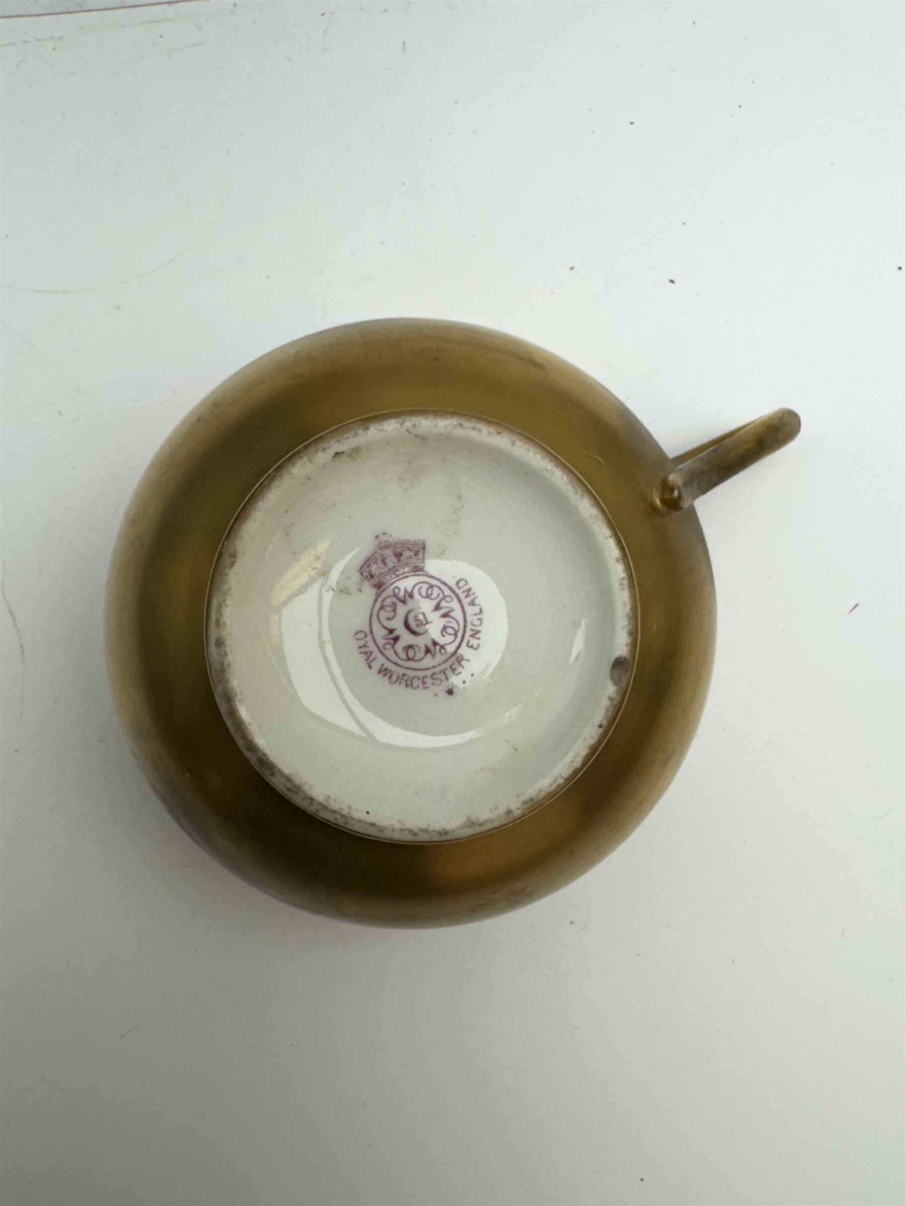 Early 20th century Royal Worcester cup and saucer decorated by Thomas Lockyer, the interior of the cup and the saucer decorated with fruit to a mossy background, with puce printed mark beneath 