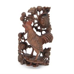 Chinese carved hardwood cockerel amongst carved peonies, H29cm