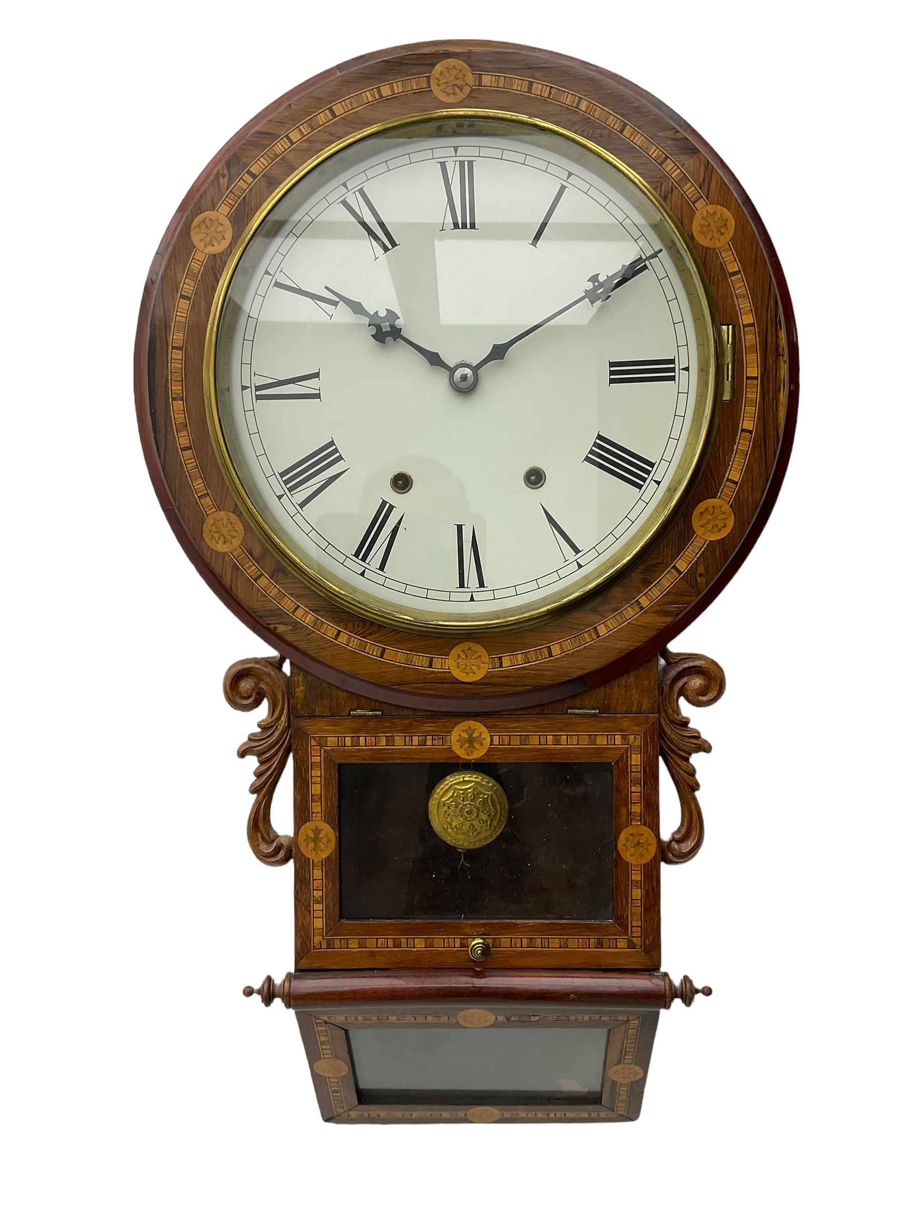 An American 'New Haven' late-19th century wall clock in a Rosewood case with parquetry inlay, carved 'ears' flanking the glazed pendulum viewing door with a glazed sloping base beneath, 12