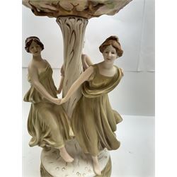 Royal Dux centrepiece, modelled as the Three Graces beneath a floral compote, upon a circular base, H51cm