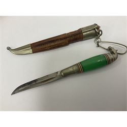 Two Scandinavian bowie knives, the first example with polished green handle with horse head final in white metal, with brown leather sheath, blade L6cm overall L12cm, the second with a polished bone handle, in black sheath with white metal tip, blade L11cm overall 23cm