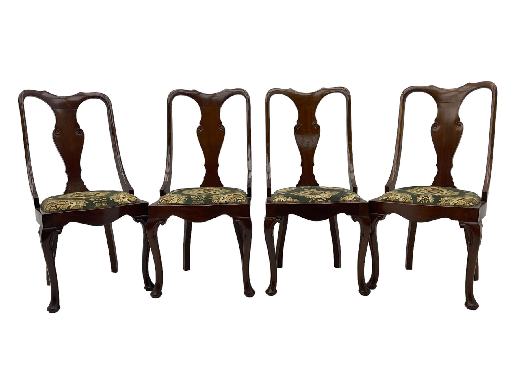 Set of eight late 19th century mahogany spoon back dining chairs, each with shaped top rail over Queen Anne design vase-shaped splat, upholstered seats in floral patterned fabric, raised on cabriole supports with scroll carved knees