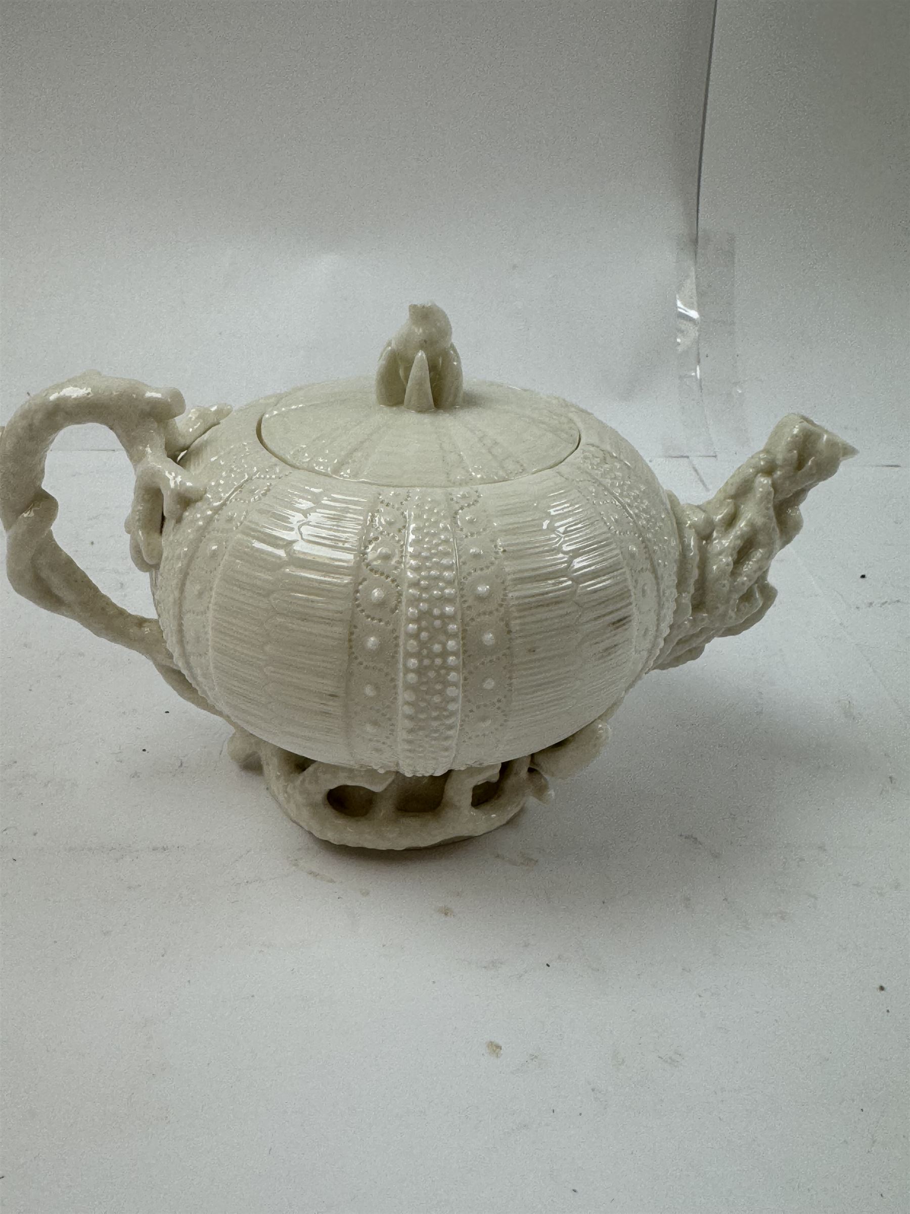 Belleek Sea Urchin teapot and sugar basin, together with Belleek Nautilus jug, small dish, teacup and saucer