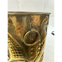 Arts and Craft brass coal box of cylindrical, with embossed stylised leaf panels, with twin handles, the cover with triform handle, H42cm 