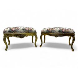 Pair of Louis XV-design giltwood stools, each upholstered in floral tapestry fabric, the c...