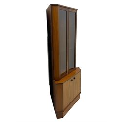 Nathan - teak corner display cabinet, double glazed doors enclosing two adjustable shelves over single cupboard.