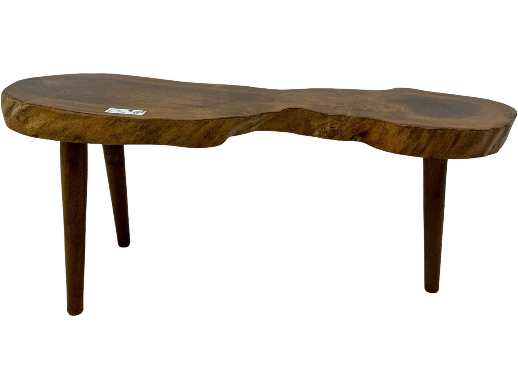 Mid-20th century live edge walnut coffee table, the top showcases the natural grain and organic form of the wood, supported by three tapered legs 