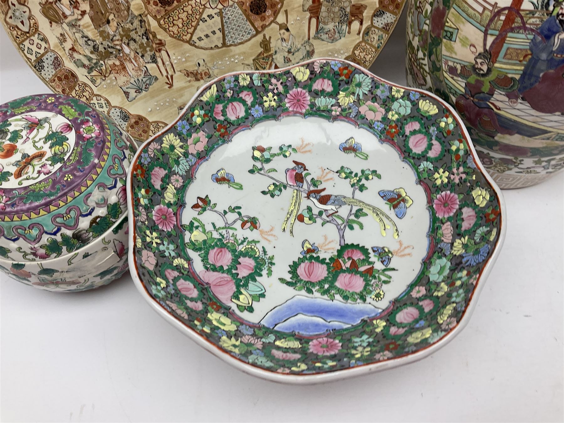 20th century Chinese famille rose jar, the body decorated in polychrome enamels with floral and foliate decoration on a white ground with a central figural panel and gilt key border to base, with six character mark beneath, H31cm, with later turned wooden cover, together with a similar footed bowl and jar,  jar cover with temple dog finial and a large Japanese Satsuma charger